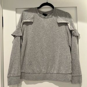 Grey sweater shirt with ruffle shoulder